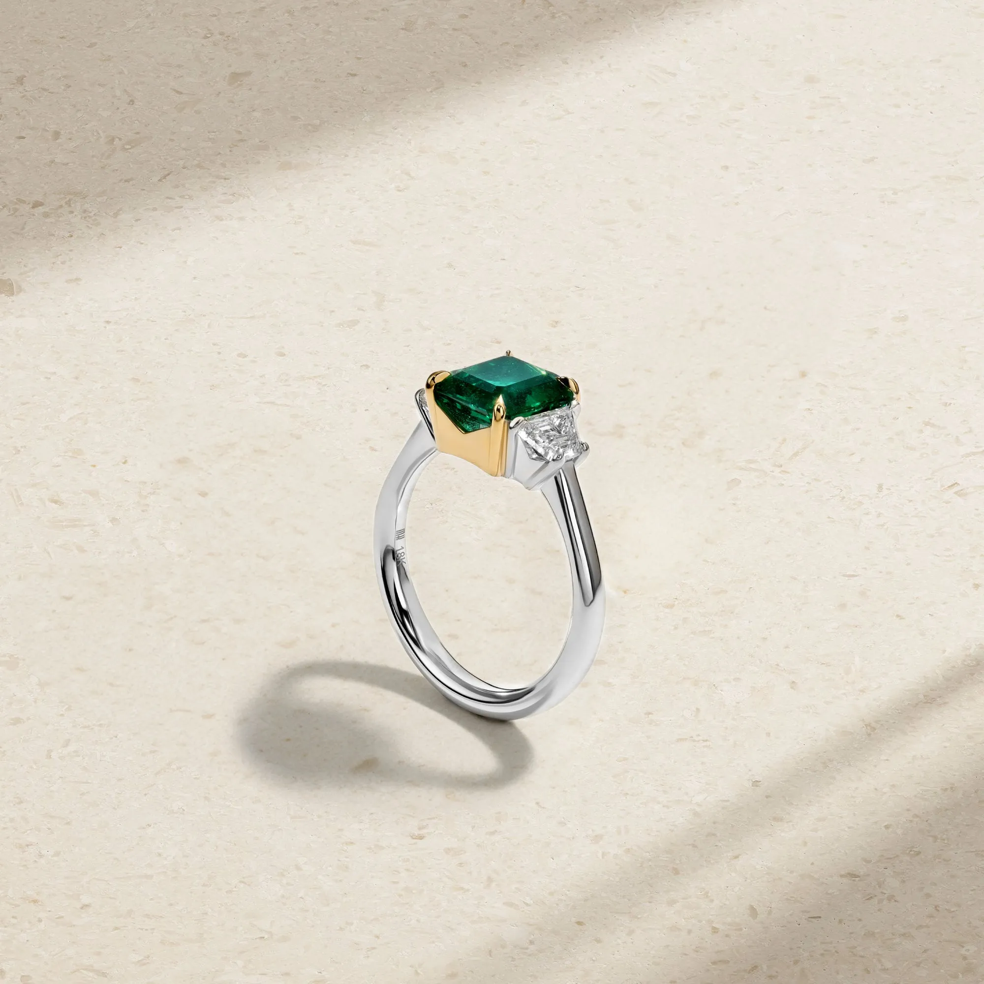 Nouveau Two Tone Three Stone Emerald and Diamond Ring