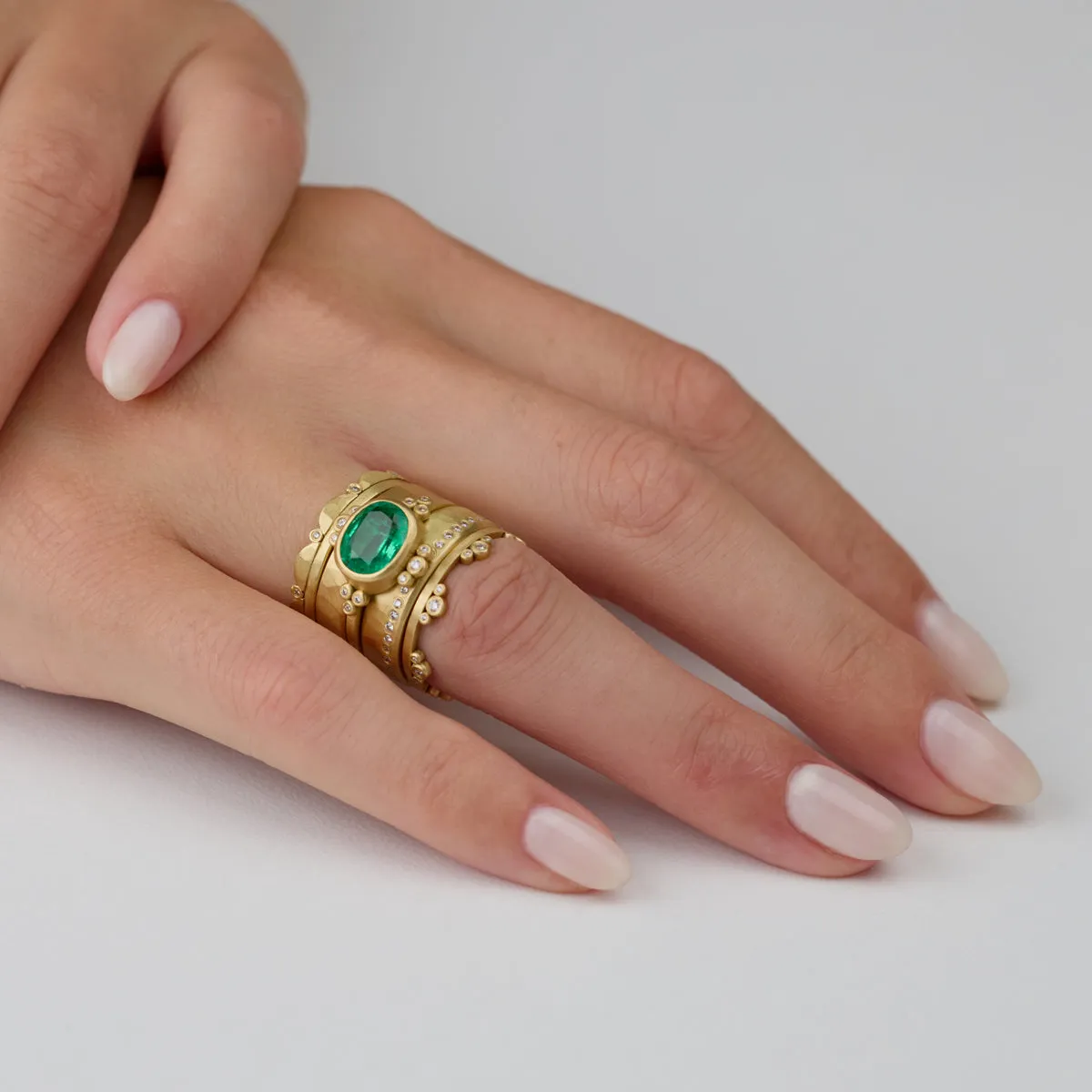 Oval Emerald Ring With Diamond Trios