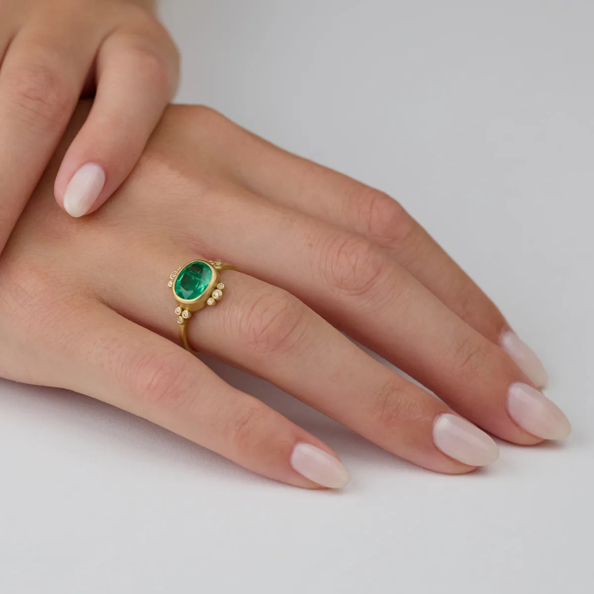 Oval Emerald Ring With Diamond Trios