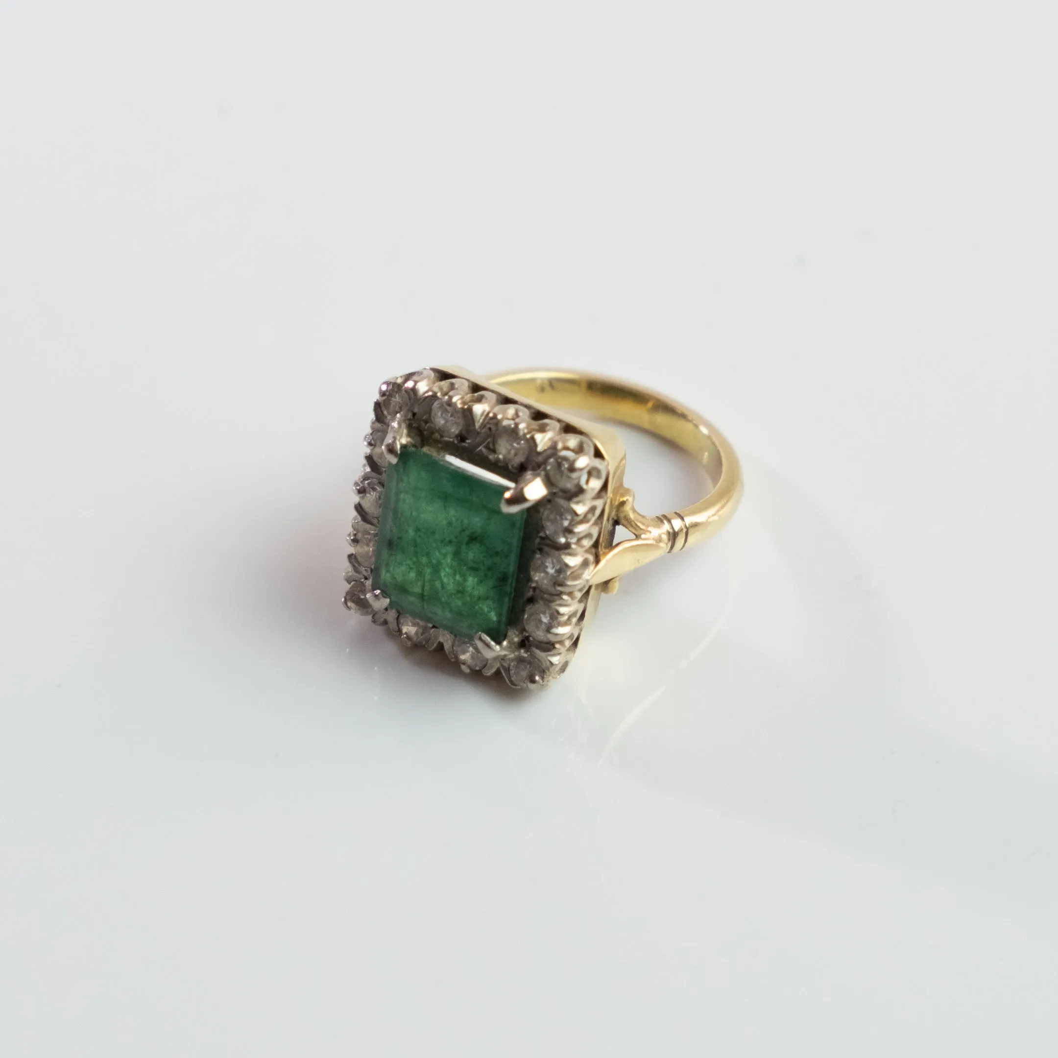 S O L D 1930, LONDON WHITE AND YELLOW GOLD EMERALD AND DIAMOND CLUSTER RING