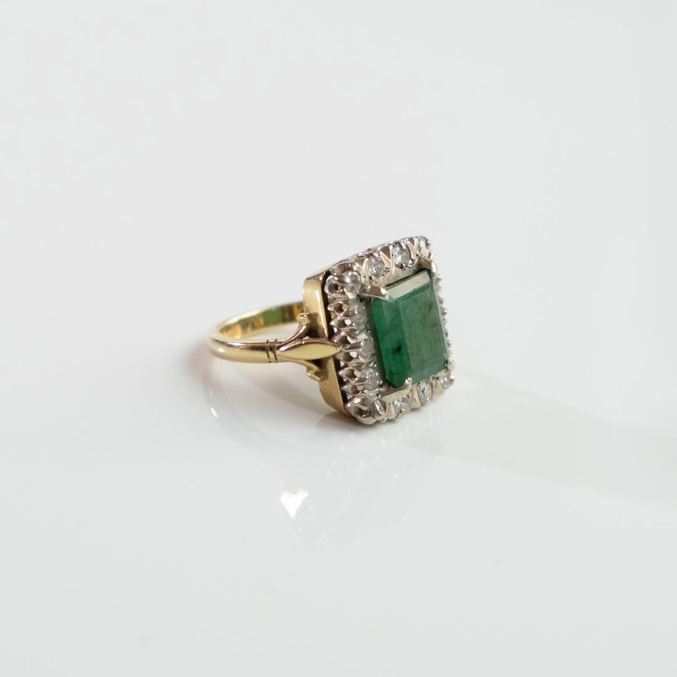 S O L D 1930, LONDON WHITE AND YELLOW GOLD EMERALD AND DIAMOND CLUSTER RING